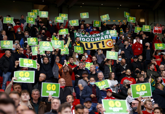 file-photo-dated-18-05-2021-of-manchester-united-fans-holds-up-protest-posters-prior-to-the-premier-league-match-at-old-trafford-manchester-issue-date-friday-may-21-2021