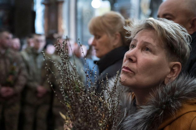 lviv-lviv-ukraine-17th-apr-2022-a-lady-seen-while-praying-lviv-residents-celebrate-the-liturgy-of-catholic-easter-in-saints-peter-and-paul-garrison-church-former-jesuit-church-in-the-western-c