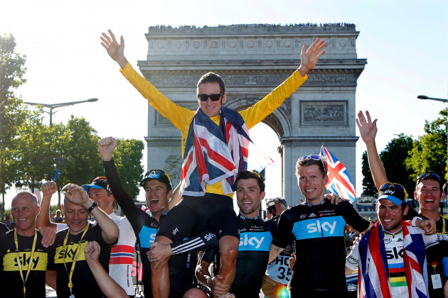 sky-procycling-rider-and-leaders-yellow-jersey-bradley-wiggins-of-britain-wears-a-british-national-flag-as-he-celebrates-with-team-mates-his-overall-victory-in-front-the-arc-de-triomphe-in-paris-afte