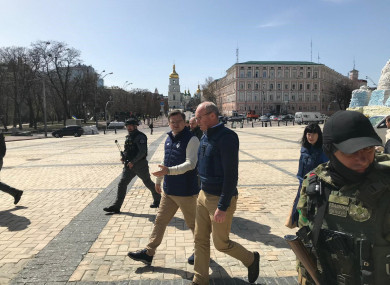kyiv-ukraine-14-april-2022-irelands-minister-for-foreign-affairs-simon-coveney-and-kuleba-walking-with-ukrainian-special-forces-and-garda-eru-to-lay-flowers-at-a-memorial-wall-in-kyiv-credit-i-390x285