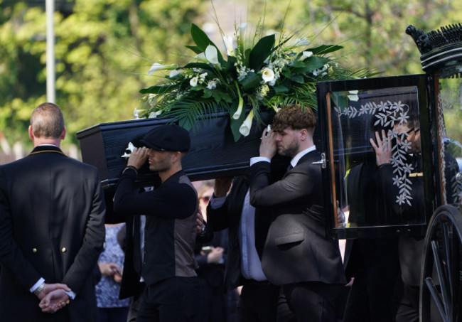 max-george-left-and-jay-mcguiness-of-the-wanted-centre-carry-the-coffin-at-the-funeral-of-their-bandmate-tom-parker-at-st-francis-of-assisi-church-in-queensway-petts-wood-in-south-east-london-f