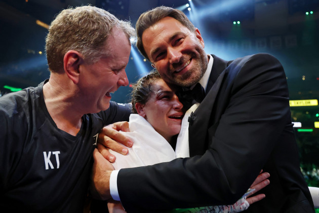 katie-taylor-celebrates-winning-with-eddie-hearn-and-brian-peters