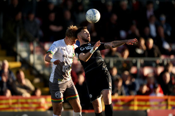 kris-twardek-and-robert-mccourt-challenge-for-the-ball