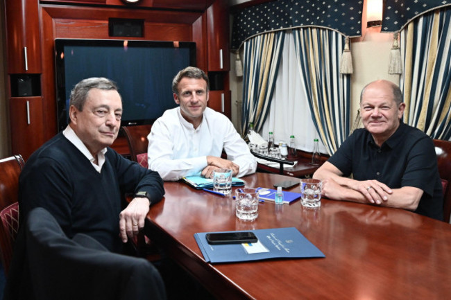 french-president-emmanuel-macron-accompanied-by-italian-prime-minister-mario-draghi-and-german-chancellor-olaf-scholz-seen-on-board-a-train-en-route-to-kiev-ukraine-on-june-16-2022-the-three-lead