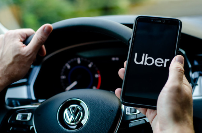 soestgermany-august42019uberdriverholdingsmartphone