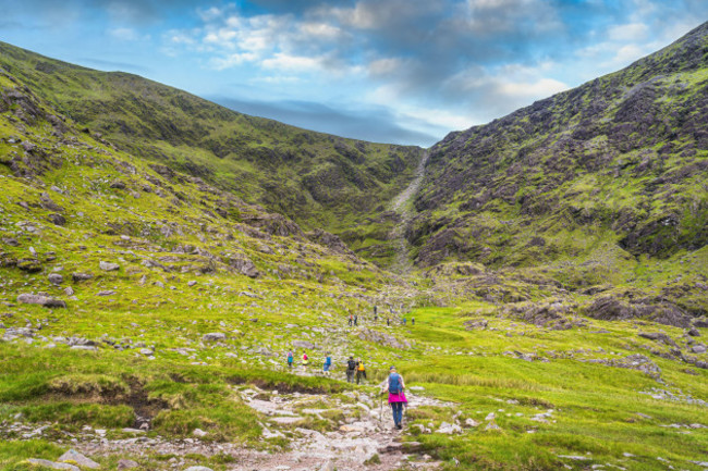 group-of-hikers-starting-to-climb-devils-ladder-to-reach-carrauntoohil-mountain