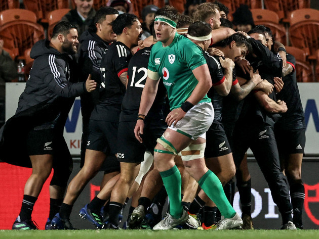 zarn-sullivan-celebrates-scoring-their-first-try-with-teammates-as-joe-mccarthy-looks-on-dejected
