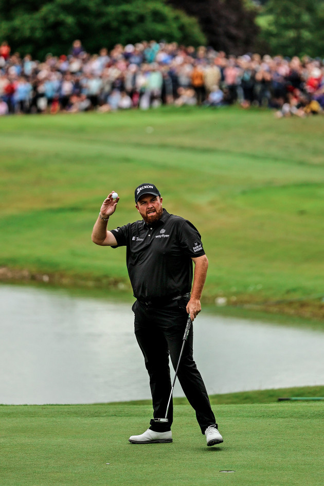 shane-lowry-acknowledges-the-crowd-after-he-sinks-his-final-putt-of-the-round-on-the-18th