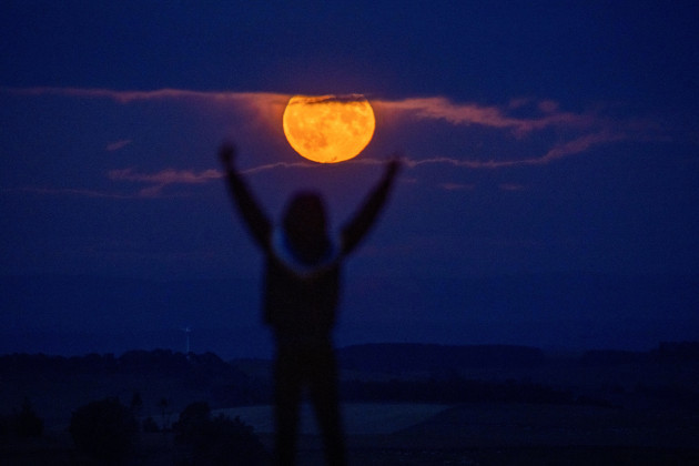 lauder-moor-scottish-borders-uk-13th-july-2022-uk-the-supermoon-on-july-13th-2022-rises-through-low-clouds-as-viewed-from-lauder-moor-in-the-scottish-borders-oscar-wilkinson-stayed-up-late-to-w