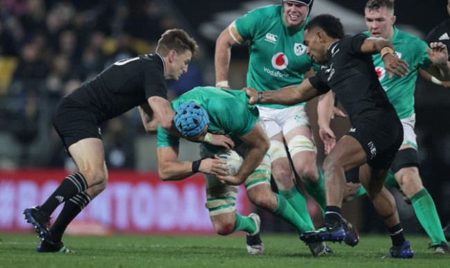 irelands-tadhg-beirne-is-tackled-by-all-blacks-beauden-barrett-and-sevu-reece-1672022