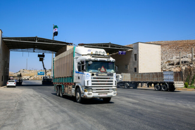 july-11-2021-bab-al-hawa-border-crossing-idlib-governorate-syria-bab-al-hawa-border-crossing-syria-11-july-2021-lorries-transporting-humanitarian-aid-enter-syria-through-the-bab-al-hawa-border