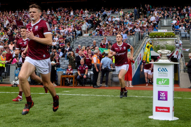 john-daly-runs-out-past-the-sam-maguire