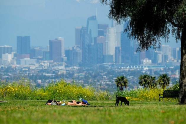 april-25-2020-los-angeles-california-u-s-people-rest-on-grasses-at-kenneth-hahn-state-recreation-area-saturday-april-25-2020-in-los-angeles-southern-californias-weather-was-taking-a-significa