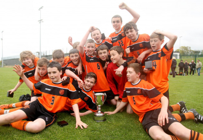 st-kevins-team-celebrate-with-the-trophy