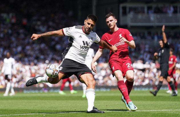 fulhams-aleksandar-mitrovic-left-and-liverpools-andrew-robertson-battle-for-the-ball-during-the-premier-league-match-at-craven-cottage-london-picture-date-saturday-august-6-2022