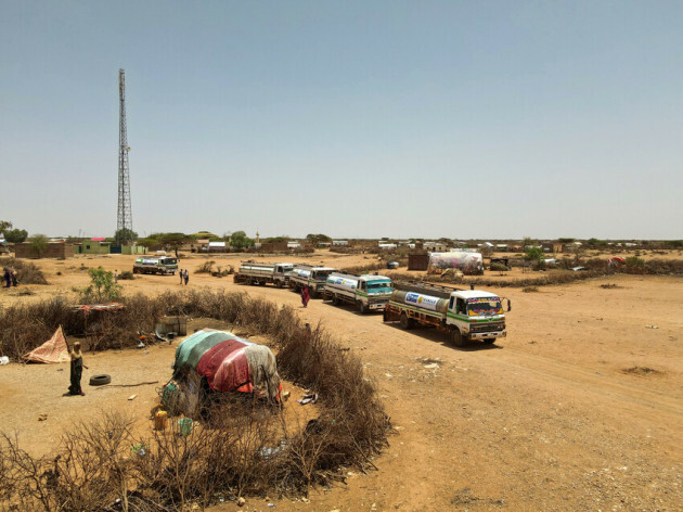 Trucks deliver water to wells