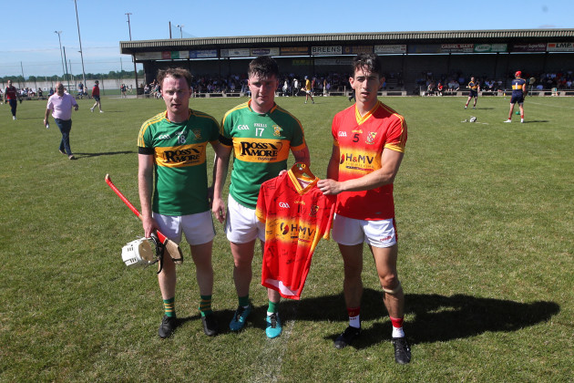 jimmy-ryan-and-cathel-bourke-are-presented-with-a-jersey-from-pat-molloy