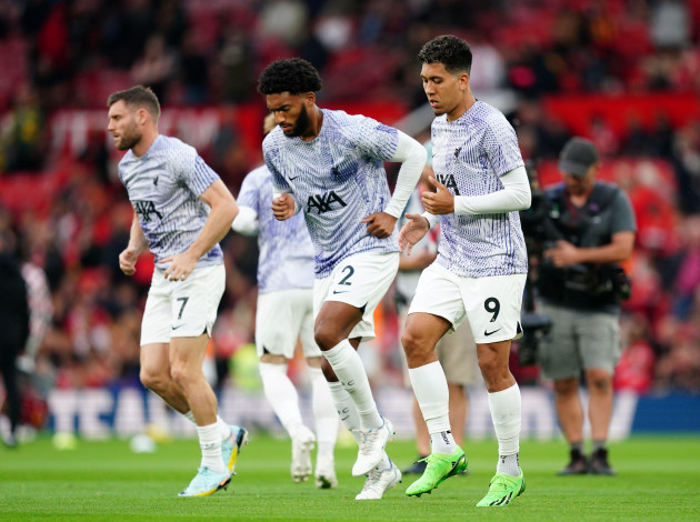 liverpools-roberto-firmino-right-and-joe-gomez-warming-up-before-the-premier-league-match-at-old-trafford-manchester-picture-date-monday-august-22-2022