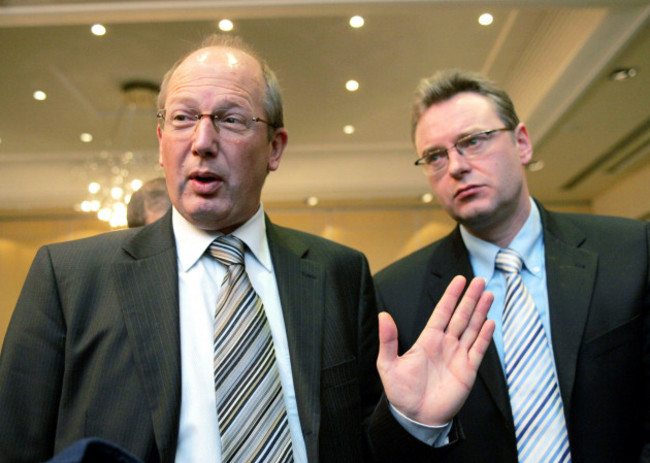 soccer-clubs-g14-general-manager-thomas-kurth-l-of-switzerland-speaks-as-he-stands-near-belgian-lawyer-jean-louis-dupont-during-a-news-conference-in-lyon-december-7-2005-olympique-lyon-are-suing