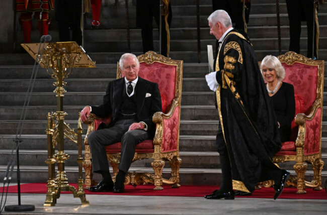 speaker-of-the-house-of-commons-sir-lindsay-hoyle-walks-past-king-charles-iii-and-the-queen-consort-at-westminster-hall-london-where-both-houses-of-parliament-are-meeting-to-express-their-condolence