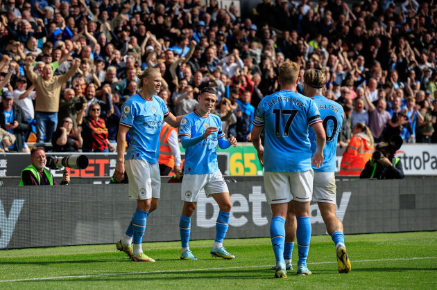 phil-foden-47-of-manchester-city-celebrates-his-goal-to-make-it-0-3-with-team-mates-during-the-premier-league-match-wolverhampton-wanderers-vs-manchester-city-at-molineux-wolverhampton-united-kingd