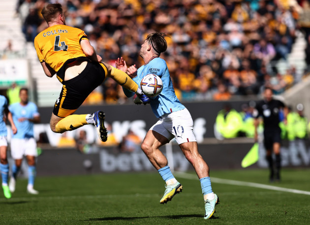 wolverhampton-uk-17th-september-2022-nathan-collins-of-wolverhampton-wanderers-goes-in-high-on-jack-grealish-of-manchester-city-for-a-red-card-during-the-premier-league-match-at-molineux-wolverha