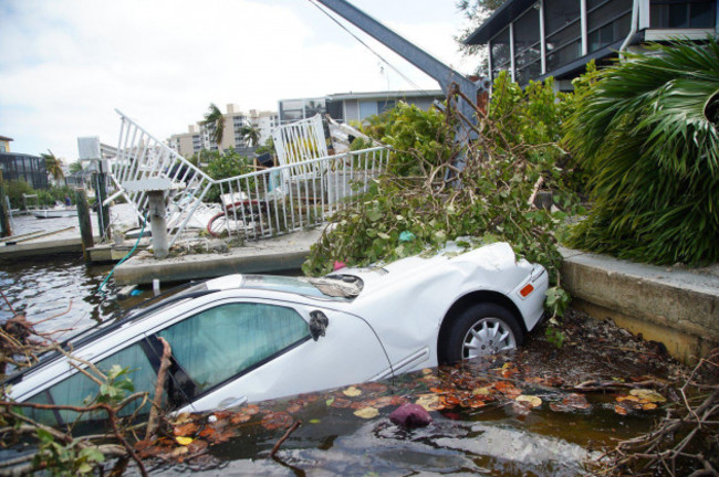 bonita-beach-florida-usa-29th-sep-2022-vehicles-thrown-into-a-canal-by-hurricane-ian-are-seen-on-thursday-sept-29-2022-in-bonita-beach-credit-image-luis-santanatampa-bay-times-via-z