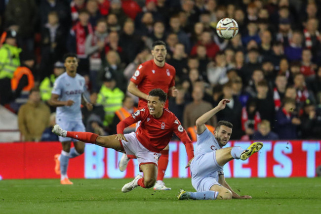 nottingham-uk-10th-oct-2022-john-mcginn-7-of-aston-villa-fouls-brennan-johnson-20-of-nottingham-forest-and-receives-a-yellow-card-during-the-premier-league-match-nottingham-forest-vs-aston-villa