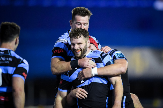thomas-young-celebrates-after-scoring-a-try-with-james-botham-and-jason-harries