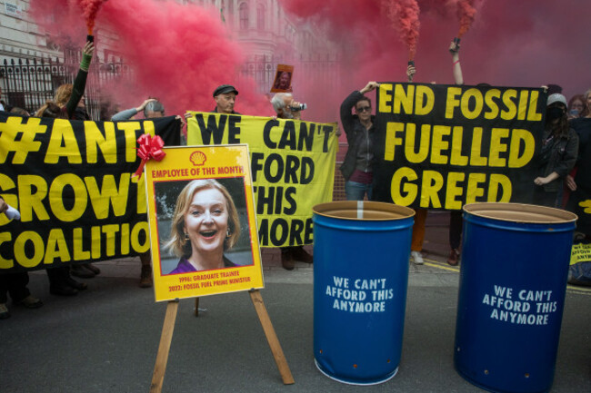 london-uk-14th-october-2022-extinction-rebellion-climate-activists-hold-smoke-grenades-outside-downing-street-during-a-we-cant-afford-this-any-mo