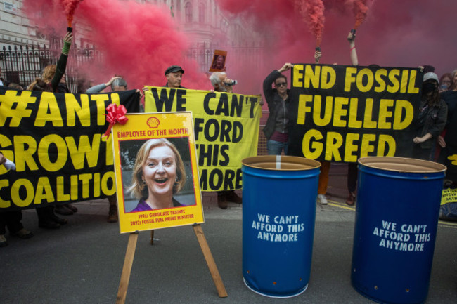 london-uk-14th-october-2022-extinction-rebellion-climate-activists-hold-smoke-grenades-outside-downing-street-during-a-we-cant-afford-this-any-mo
