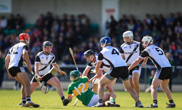 danny-slattery-is-surrounded-by-kilruane-macdonaghs-players