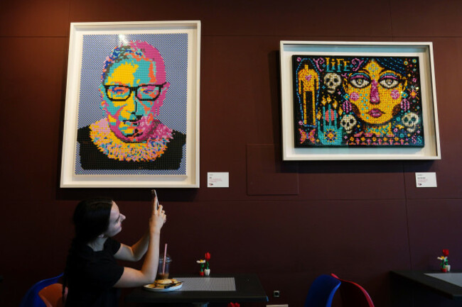 lily-higgins-admires-ruth-bader-ginsburg-by-jill-gill-left-and-day-of-the-dead-by-steve-simpson-which-form-part-of-the-dublin-dots-exhibition-at-the-opening-of-the-worlds-first-experimental