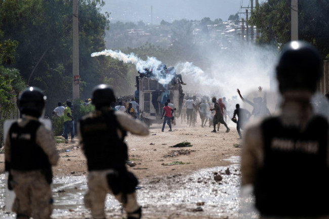 haitian-national-police-officers-deploy-tear-gas-during-a-protest-demanding-the-resignation-of-haitis-prime-minister-ariel-henry-after-weeks-of-shortages-in-port-au-prince-haiti-october-17-2022-r