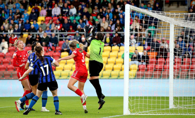 jessie-stapleton-challenges-goalkeeper-niamh-coombes-in-the-air-and-scores-a-goal