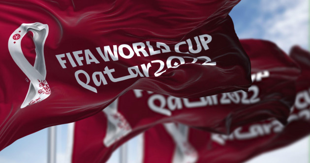 doha-qatar-april-2022-three-flags-with-the-qatar-2022-fifa-world-cup-logo-waving-in-the-wind-the-event-is-scheduled-in-qatar-from-21-november-to-1