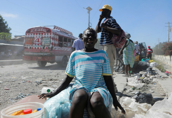 a-woman-displaced-by-gang-violence-reacts-after-she-and-others-were-removed-by-authorities-from-the-hugo-chavez-square-where-they-had-taken-refuge-in-port-au-prince-haiti-november-17-2022-reuters