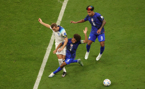 englands-harry-kane-and-us-tyler-adams-fight-for-the-ball-during-a-soccer-game-between-england-and-the-united-states-in-group-b-of-the-fifa-2022-world-cup-in-doha-state-of-qatar-on-friday-25-novemb