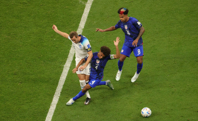 englands-harry-kane-and-us-tyler-adams-fight-for-the-ball-during-a-soccer-game-between-england-and-the-united-states-in-group-b-of-the-fifa-2022-world-cup-in-doha-state-of-qatar-on-friday-25-novemb