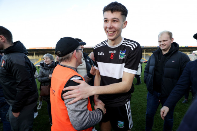 emmet-rigter-celebrates-after-the-game-with-manager-jimmy-lee