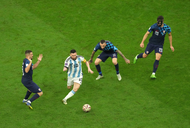 croatias-mateo-kovacic-argentinas-lionel-messi-croatias-marcelo-brozovic-and-josko-gvardiol-left-right-in-action-during-the-fifa-world-cup-semi-final-match-at-the-lusail-stadium-in-lusail-qata