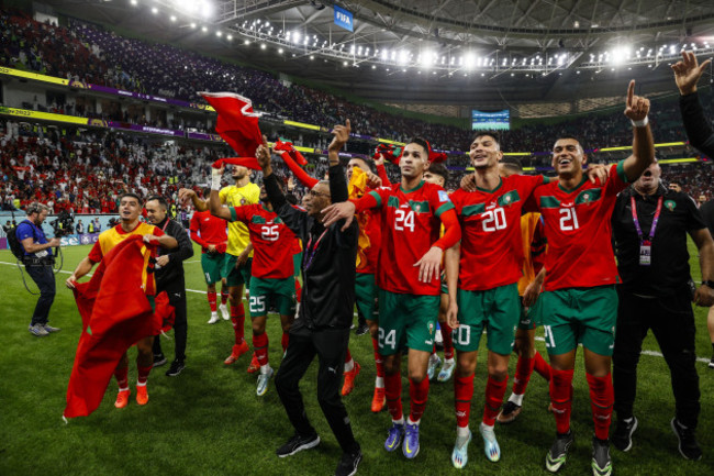 doha-qatar-10122022doha-players-of-morocco-celebrate-victory-after-the-fifa-world-cup-qatar-2022-quarterfinal-match-between-morocco-and-portugal-at-al-thumama-stadium-on-december-10-2022-in-d