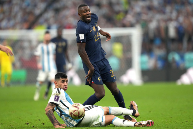 frances-marcus-thuram-reacts-after-being-tackled-by-argentinas-cristian-romero-during-the-fifa-world-cup-final-at-lusail-stadium-qatar-picture-date-sunday-december-18-2022