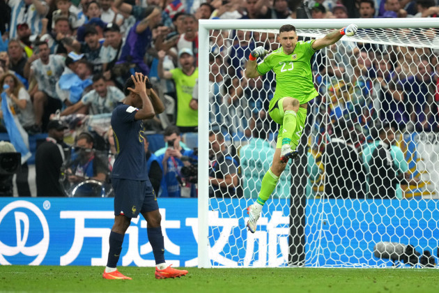argentina-goalkeeper-emiliano-martinez-right-celebrates-after-saving-frances-kingsley-comans-penalty-in-the-penalty-shoot-out-after-extra-time-during-the-fifa-world-cup-final-at-lusail-stadium-qa