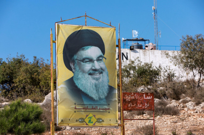 a-poster-depicting-lebanons-hezbollah-leader-sayyed-hassan-nasrallah-is-seen-in-marwahin-southern-lebanon-october-11-2022-reutersaziz-taher