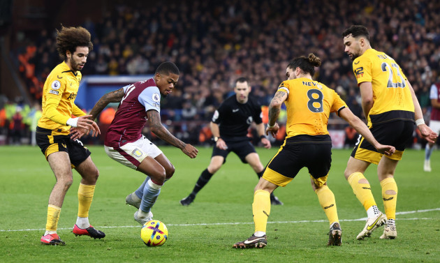 birmingham-england-4th-january-2023-leon-bailey-of-aston-villa-takes-on-three-wolves-players-during-the-premier-league-match-at-villa-park-birmingham-picture-credit-should-read-darren-staples
