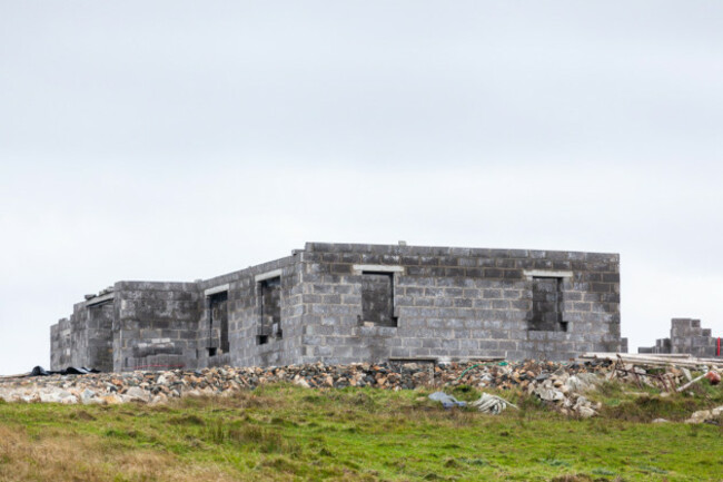 Concrete walls and frame of a house under construction