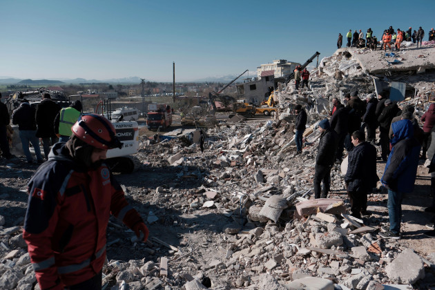 local-evacuated-residents-watch-a-rescue-operation-in-nurdagi-in-south-central-turkey-on-february-9-2023-the-devastating-earthquake-occurred-in-southern-turkey-and-syria-on-february-6th-and-more-th