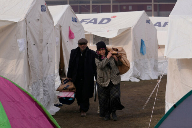 people-with-their-belongings-arrive-at-the-tents-in-kharamanmaras-southeastern-turkey-friday-feb-10-2023-rescuers-pulled-several-people-alive-from-the-shattered-remnants-of-buildings-on-friday