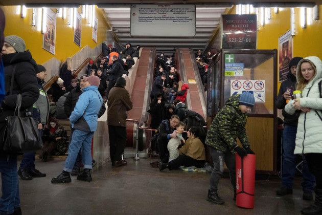 people-gather-in-a-subway-station-being-used-as-a-bomb-shelter-during-a-russian-rocket-attack-in-kyiv-ukraine-friday-feb-10-2023-ap-photoefrem-lukatsky